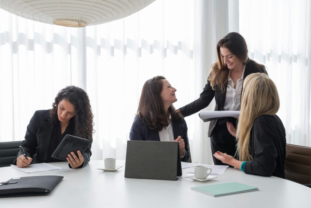 Photo by Kampus Production: https://www.pexels.com/photo/a-group-of-women-in-black-blazer-having-conversation-inside-the-office-8171204/