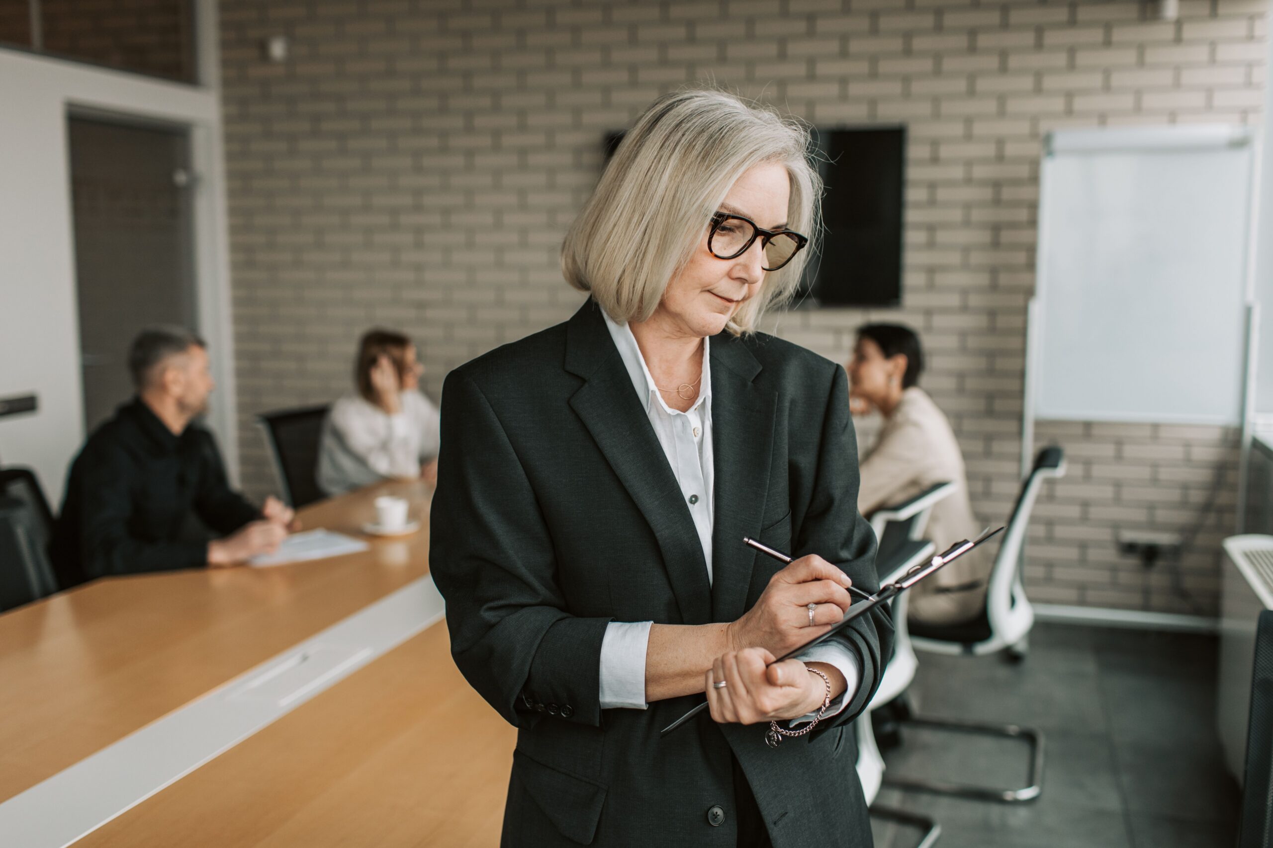 Woman holding a clipboard.